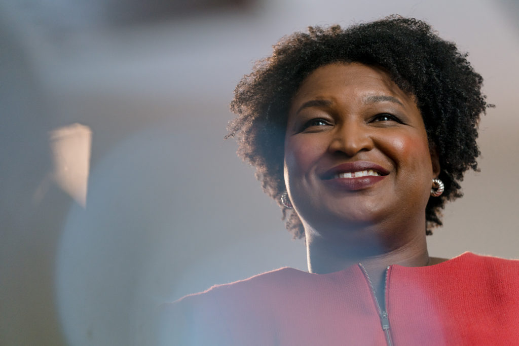 Photo of Stacey Abrams looking out over a crowd. 